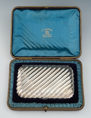 A Sterling Silver Cigarette Case Contained