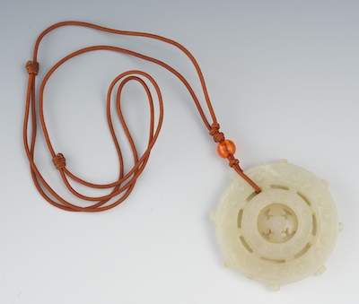 A Carved White Jade Disc Measuring