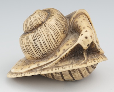 A Carved Ivory Snail Netsuke Apprx.