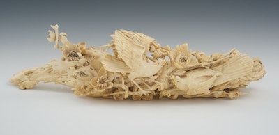 A Large Carved Ivory Bird and Flower 131f60