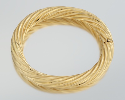 An 18k Gold Twist Design Bangle 132026