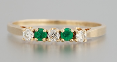 A Ladies Diamond and Emerald Ring 132036