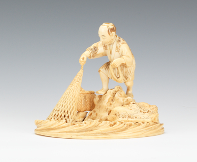 A Japanese Ivory Carving of a Fisherman