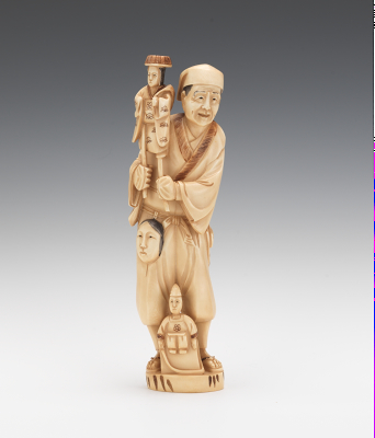 A Carved Ivory Figural of a Puppeteer