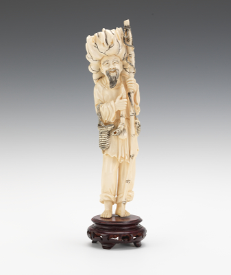 An Ivory Figure of a Fisherman A beautifully