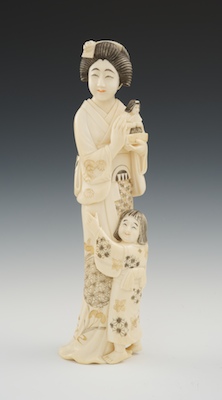 A Carved Ivory Figural of Mother