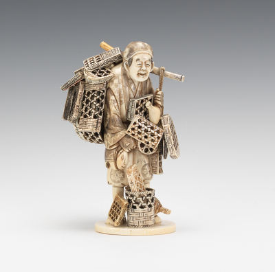 A Carved Ivory of a Basket Weaver This