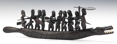 An African Sculpture of Men in a Boat