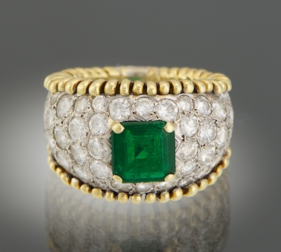 A Ladies Diamond and Emerald Ring 134b1d