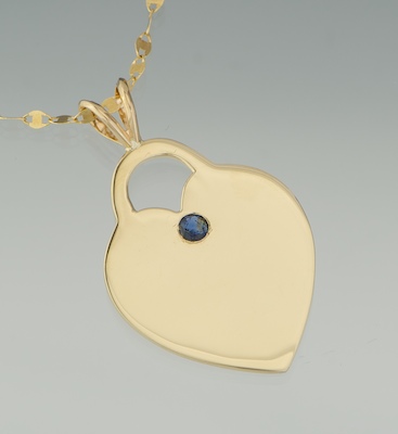 A Gold and Sapphire Heart Pendant 134b31