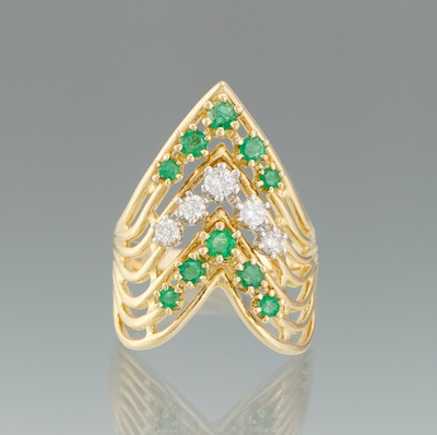 A Ladies Diamond and Emerald Ring 134b6c