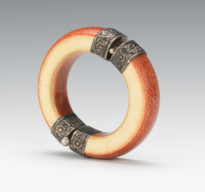 A Carved Ivory and Silver Bangle