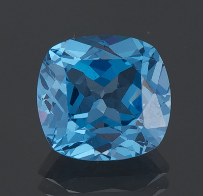 An Unmounted Blue Topaz Cushion