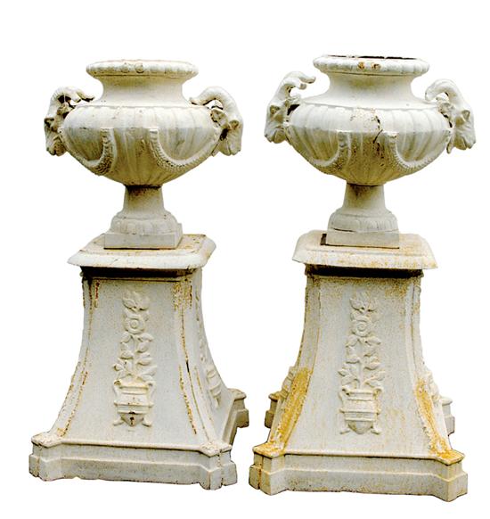 Pair cast-iron garden urns on pedestals