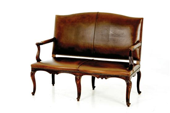 Louis XV carved walnut canape late