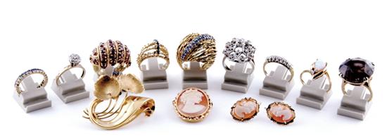 Collection gold rings brooches and earrings