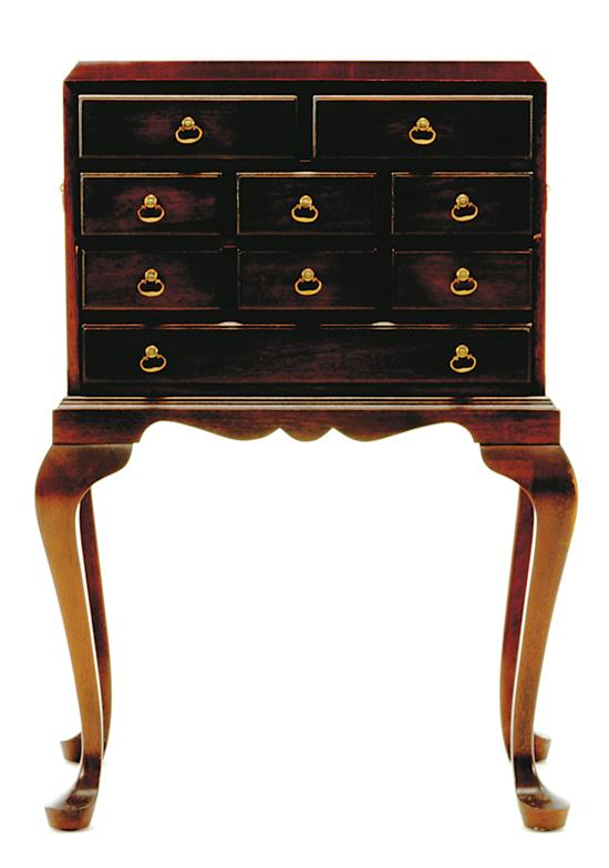 Queen Anne style mahogany silver