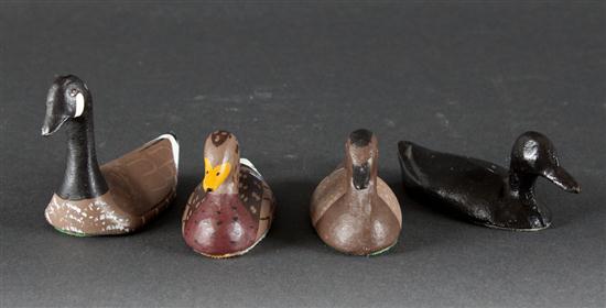 Four painted cast lead duck decoy