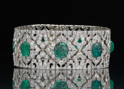 An Art Deco Platinum Carved Emerald