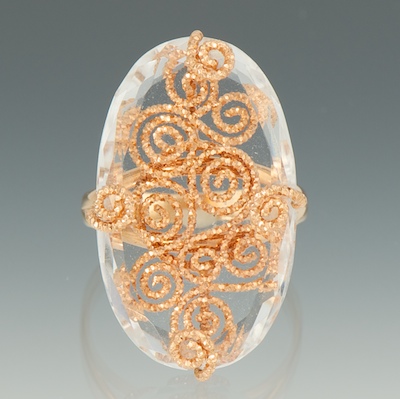 A Ladies Rose Gold and Crystal Ring