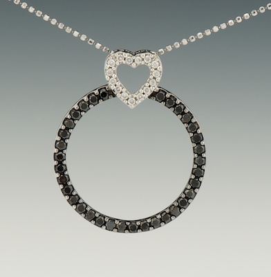 A Ladies Black and White Diamond Pendant