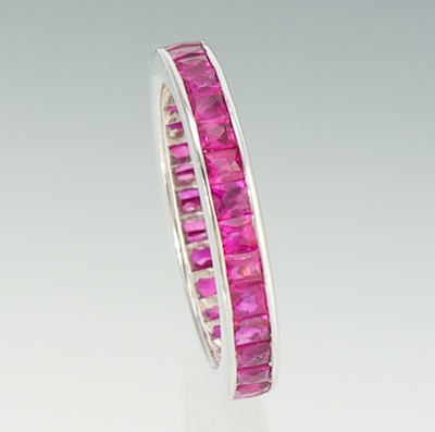 An 18k Gold and Ruby Eternity Band 18k