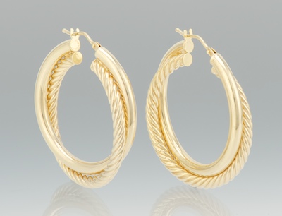 A Pair of Gold Hoop Earrings 14k