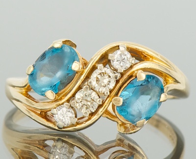 A Ladies' Topaz and Diamond Ring