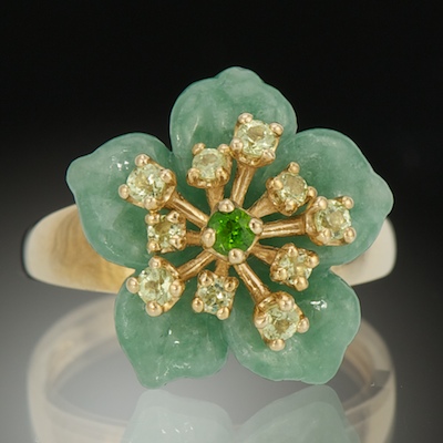 A Carved Jade Flower Ring Carved