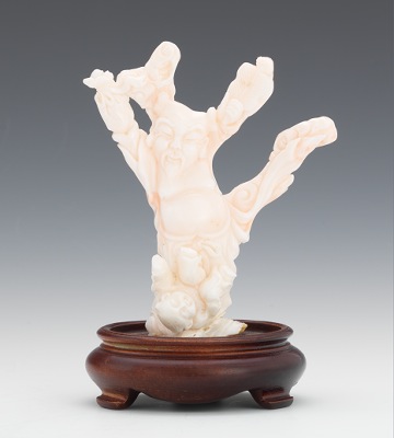 A Carved Angelskin Coral Figurine Carved