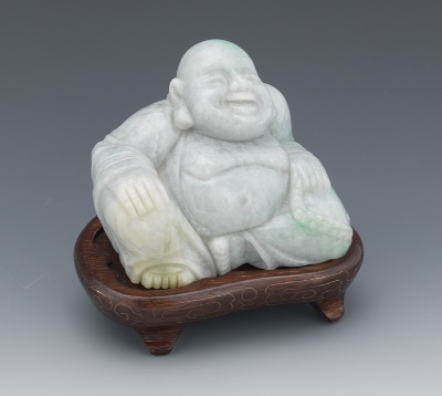 A Carved Hardstone Buddha Smiling seated