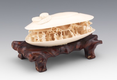 A Carved Ivory Anabori Netsuke Shell