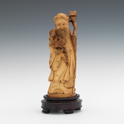 A Carved Ivory Figure of an Immortal