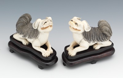 A Pair of Carved Ivory Foo Dog
