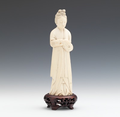 A Carved Ivory Figure of a Lady Depicted
