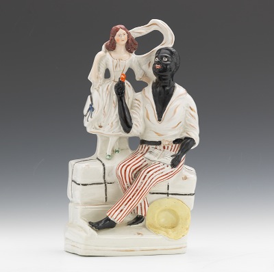 A Uncle Tom & Eva Figural Situated on