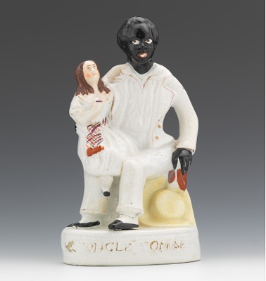 A Uncle Tom & Eva Figural Seated Uncle