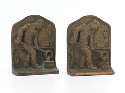 A Pair of Bronze Bookends of Foundry