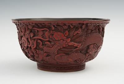 A Carved Cinnabar Dragon Bowl Round