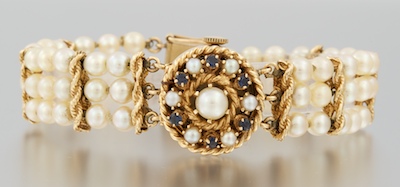 A Vintage Gold Watch with Pearl