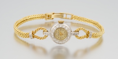 A Ladies Gold and Diamond Dress Watch