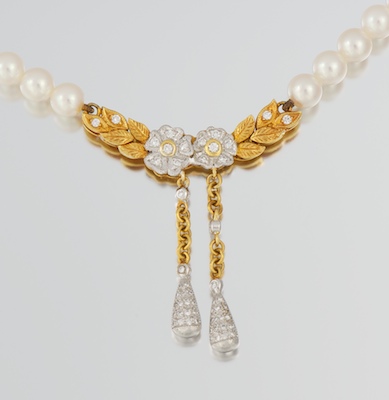 A Mikimoto Pearl 18k Gold and Diamond