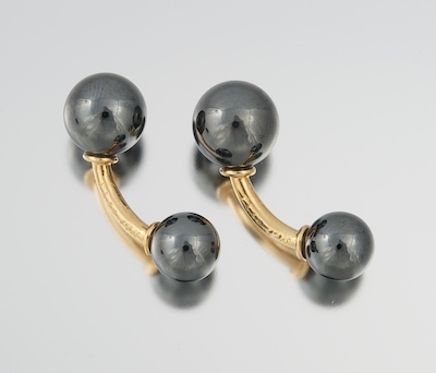 A Pair of Hematite and Gold Cufflinks