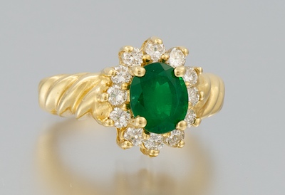 A Ladies Diamond and Emerald Ring 1340d0