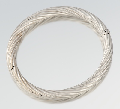 A Ladies' White Gold Twisted Bangle