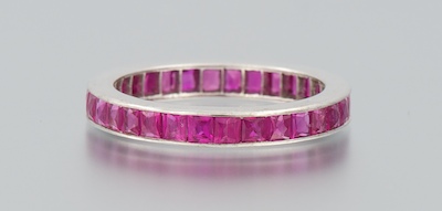 An 18k Gold and Ruby Eternity Band 18k