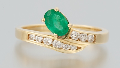 A Ladies' Diamond and Emerald Ring
