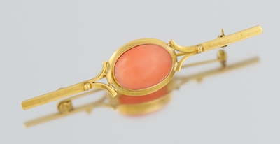 A Ladies' 18k Gold and Coral Cabochon