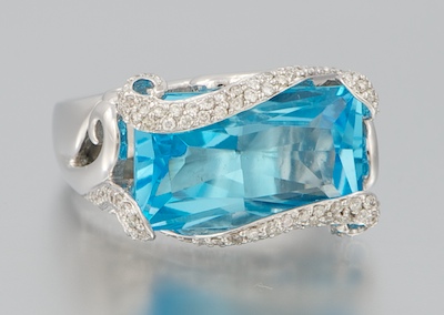 A Ladies' Topaz and Diamond Ring