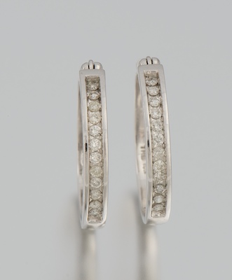 A Pair of Diamond Hoop Earrings 134159